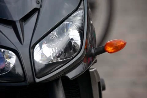 Front of a modern motorcycle with headlight. two-wheeled transport Stock Photos