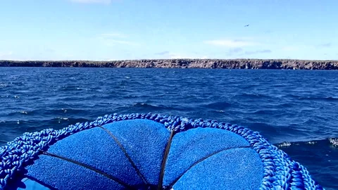 Front of motorized raft speeding though ocean waves passenger view action video Stock Footage 343007327