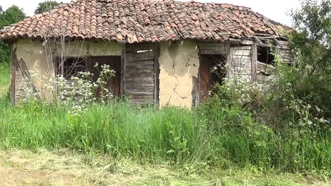 In front of the old and abandoned hut 스톡 동영상 111376339