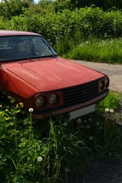 The front of the old Lancia car. Old, forgotten, vintage car in the village Stock Photos