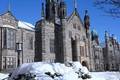 Front of old stone gothic style college building at the University of Toronto Stock Photos
