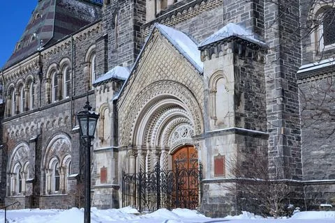 Front of old stone gothic style college building at the University of Toronto Stock Photos