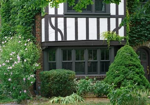 Front of old vine covered half-timbered Tudor style house Stock Photos