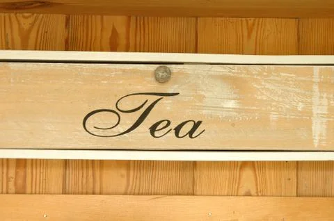 Front of old wooden tea drawer in the kitchen Stock Photos