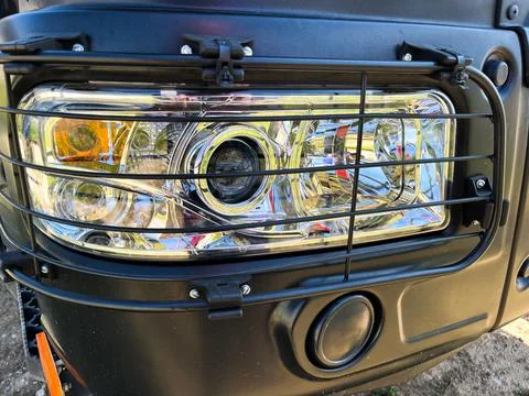 Front optics of a truck's car headlight close-up Stock Photos