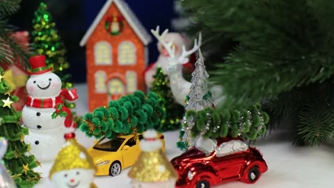 In front of the orange house there are snowmen with Christmas trees and cars Stock Footage 340202194