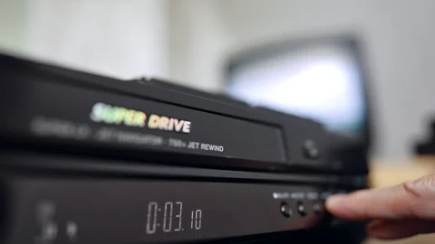 Front panel of the DVD player. Hand presses the button on the device. Close up. Stock Footage 319351611