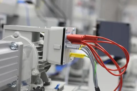 Front panel of electrical equipment with commutation wires and devices. Stock Photos