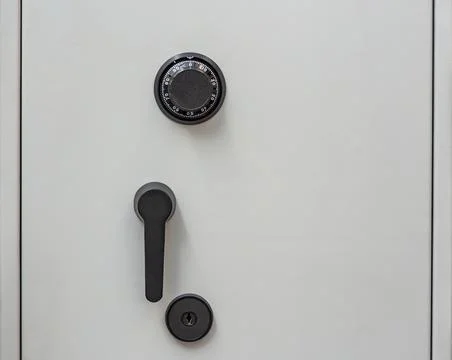 Front panel of a secure bank safe. Closed ATM Safe Door Stock Photos