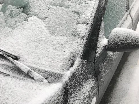 Front of parked car close up of windshield in snowy weather Stock Photos