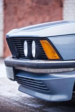 The front part headlight of old blue car Stock Photos