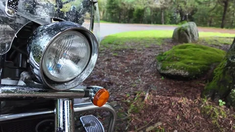 Front part, headlight with raindrops of a classic motorcycle, close-up Stock Footage 254880094