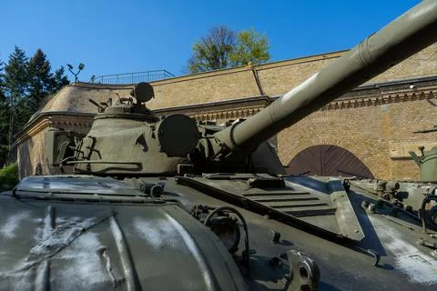 The front part of the tank is a close-up on the background of the fortress wall Stock Photos