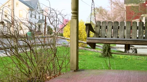 Front porch swing blowing in Stock Video Pond5