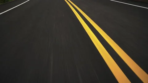 Front pov view of fast car driving on asphalt road with double yellow lines. Stock Footage 171163458