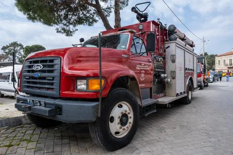 Front of red modern fire brigade truck parked in front of local fire department Stock Photos