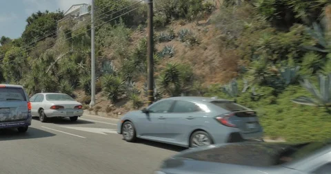 Front right driving plate - PCH at Will Rogers State Beach, Santa Monica Stock Footage 102007408