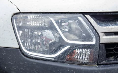 Front right headlight for Renault Duster. Crossover or SUV in white with a bl Fotos Stock