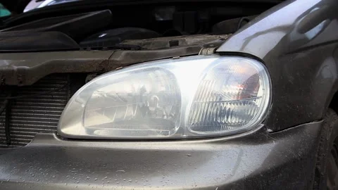 The front right side of a gray car with the hood open, revealing the engine Stock Footage 328818225