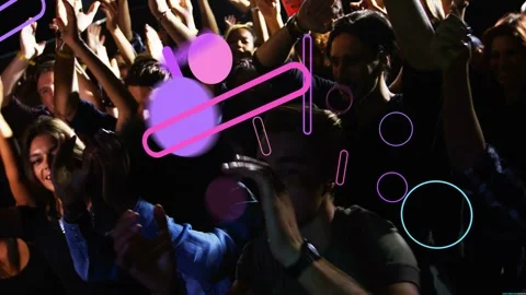 Front-row crowd clapping and swaying to music, beat releasing neon shapes Stock Footage 332804723