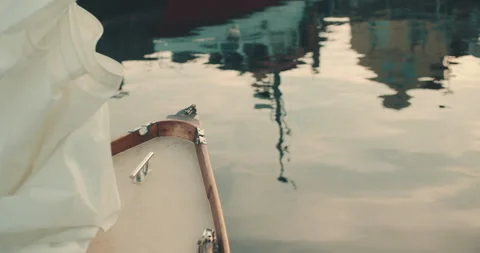 Front of a sailboat water reflection sunset harbour 4k Stock-Footage 153493771