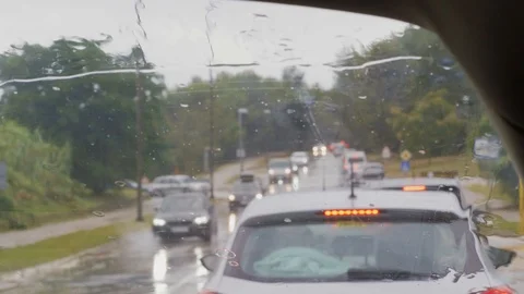 Front screen and rain drops on car in traffic jam, transport Stock Footage 113737180