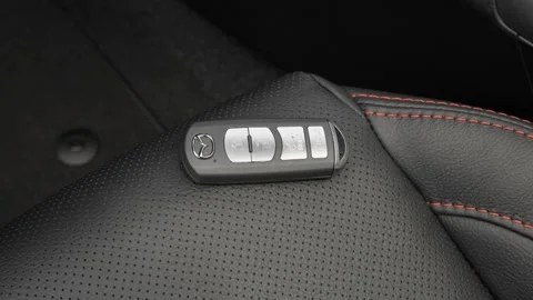 Front seat in car interior with keys close up  2016 Mazda MAZDA3 s Grand Touring Stock Footage 159859556