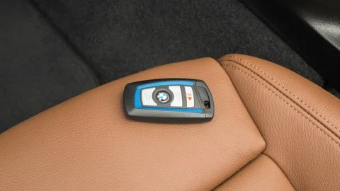 Front seat in car interior with keys close up  2016 BMW 2-series 228i Stock Footage 159866955