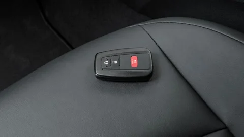 Front seat in car interior with keys close up  2016 Toyota Prius Four Touring Stock Footage 159869812