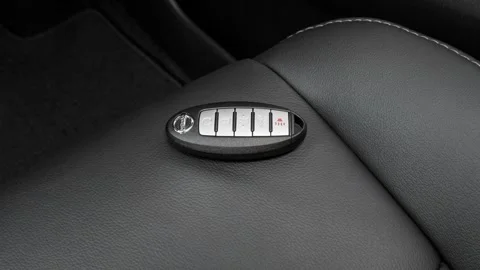 Front seat in car interior with keys close up  2016 Nissan Pathfinder Platinum Stock Footage 159873328