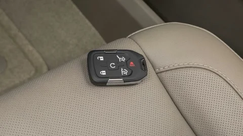 Front seat in car interior with keys close up  2016 Chevrolet Tahoe LTZ Stock Footage 159888144