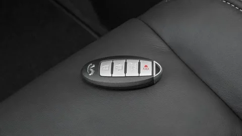 Front seat in car interior with keys close up  2016 Infiniti QX60 3.5 Stock Footage 159889647
