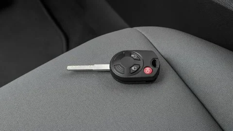 Front seat in car interior with keys close up  2017 Ford Escape S Stock Footage 159891774