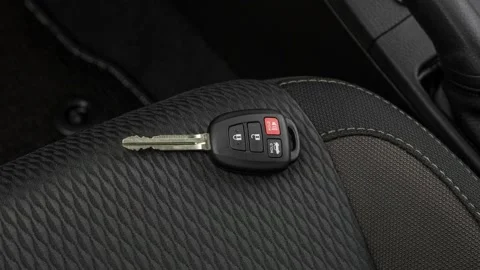 Front seat in car interior with keys close up  2017 Toyota Corolla LE Stock-Footage 159918335