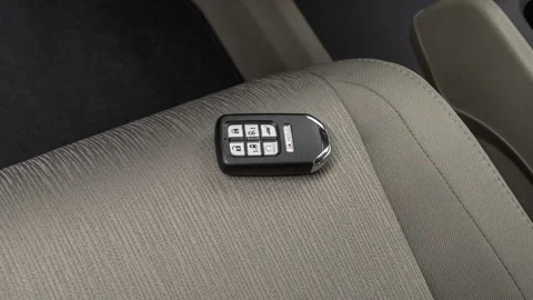 Front seat in car interior with keys close up  2018 Honda Odyssey EX Stock Footage 159951227