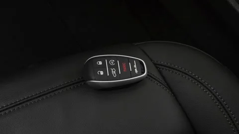 Front seat in car interior with keys close up  2018 Alfa Romeo Stelvio SE Stock Footage 159961942