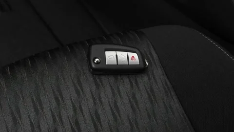 Front seat in car interior with keys close up 2018 Nissan Rogue S Stock Footage 159987583