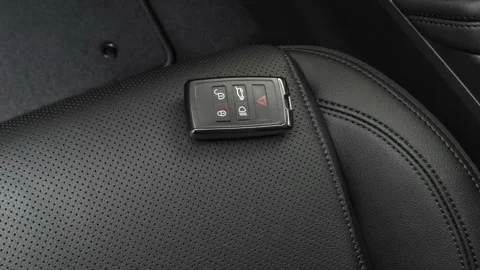Front seat in car interior with keys close up  2018 Jaguar E-Pace SE Stock Footage 160012254