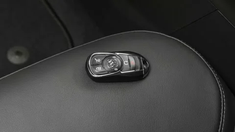 Front seat in car interior with keys close up  2019 Buick Envision Essence Stock Footage 160014634