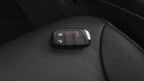 Front seat in car interior with keys close up  2019 Dodge Journey Crossroad Stock Footage 160064279