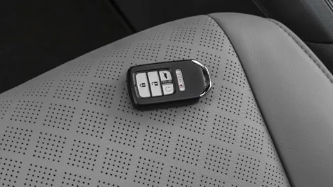 Front seat in car interior with keys close up  2019 Honda Passport Elite Stock Footage 160074353