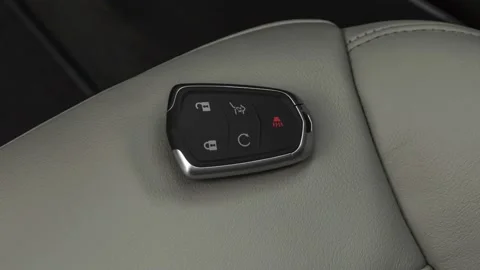 Front seat in car interior with keys close up  2019 Cadillac XT4 Premium Luxury Stock Footage 160075697