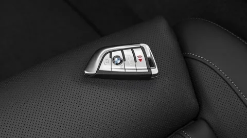 Front seat in car interior with keys close up  2020 BMW X7 M50i SUV Stock Footage 160095466