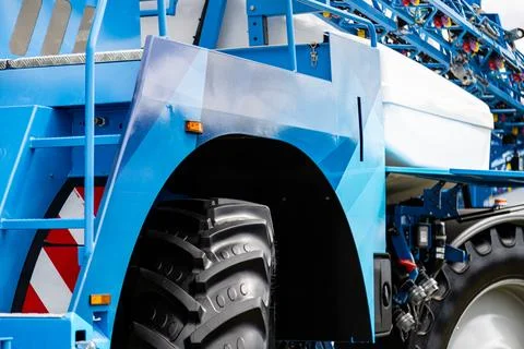 Front section of self propelled crop sprayer with large wheel Stock Photos