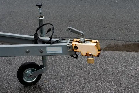 Front section of a trailer hitch on a paved surface. Stock Photos