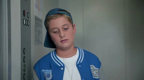 Front shot of kid waiting for elevator 스톡 동영상 34649414