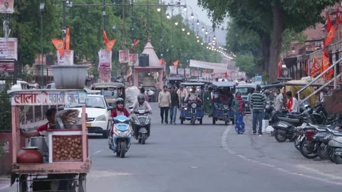 Front shot of a moving traffic and chat vendor from Indian city street Video stock 244964268