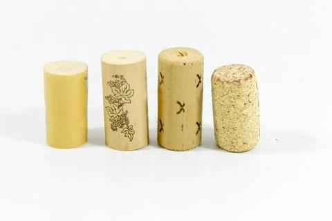 Front shot of multiple wine corks with blurry white background Stock Photos