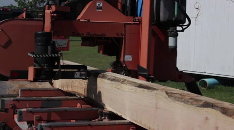 Front shot of portable sawmill cutting through log Stock Footage 40472127