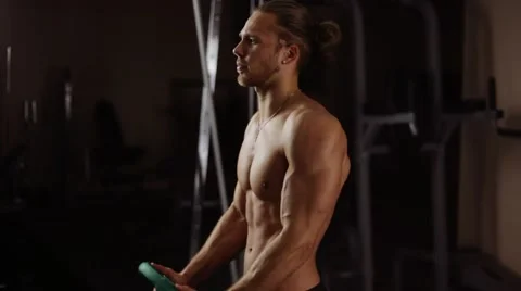 Front shoulder raise with plate. Loop Video stock 55007177